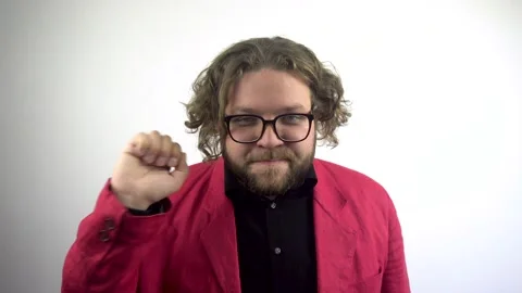 The young man knocks on the door and listens. Stockbeeldmateriaal 137104327