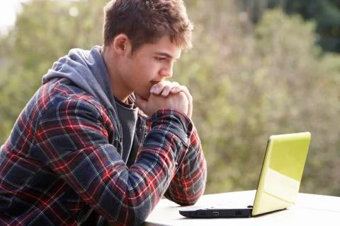 Young man with laptop computer Stock Photos