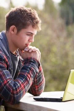 Young man with laptop computer Stock Photos