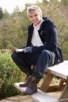 Young man with laptop computer Stock Photos