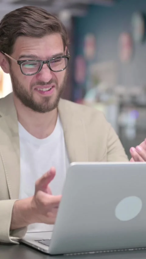 Young Man with Laptop having Loss, Failure , Vertical Video 스톡 동영상 342003747