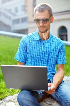 Young man with laptop Stock Photos