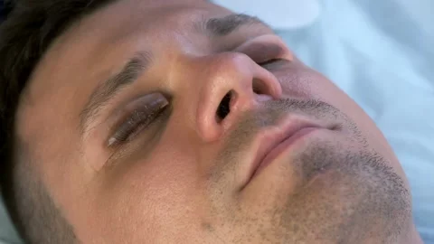 Young man on lash lifting laminating procedure in beauty clinic with close eyes. Stock Footage 158914764