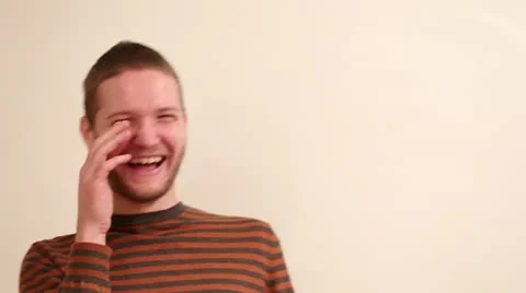 Young man laughing 库存影片 20545632