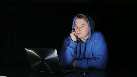 Young Man Laughing While Looking at a Screen Stock Footage 71222078