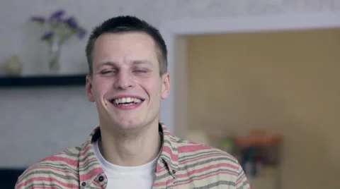 Young man laughs and puts Like Stock Footage 48218739