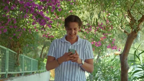 The young man laughs at what he sees on his social media accounts. Stock Footage 166161584