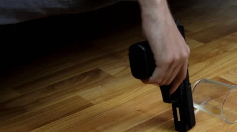 Young Man Laying In A Couch With Suicidal Thoughts With A Gun In His Hand, Tilt Stock Footage 41544714
