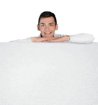 Young man leaning empty board Stock Photos