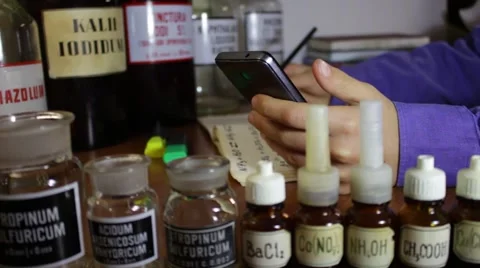 A young man-learner in the laboratory explores chemicals Vídeo Stock 58805029