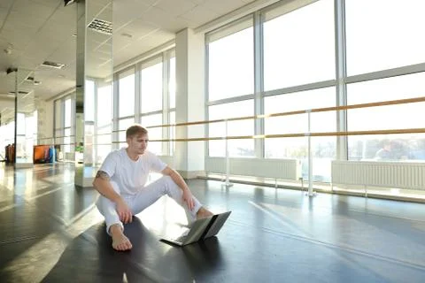 Young man learning new dancing technique with laptop tutorial. 스톡 사진