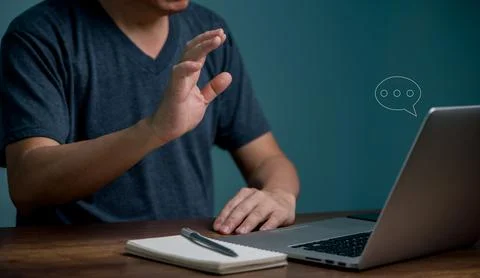 Young man learning online class and meeting online by using laptop computer a Stock Photos
