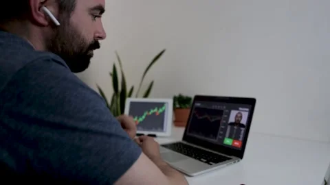 Young man learning online cryptocurrencies stock market from home Stock Footage 155585610