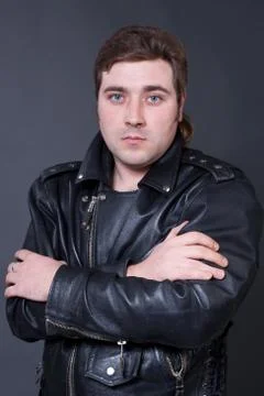 Young man in a leather jacket Stock Photos
