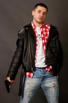 Young man in a leather jacket Stock Photos
