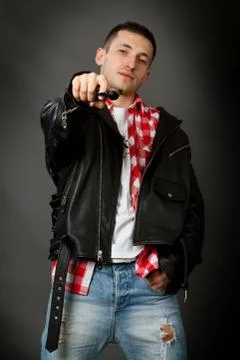Young man in a leather jacket Stock Photos