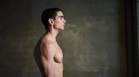 Young man lifting dumbbells Stock Footage 68354533