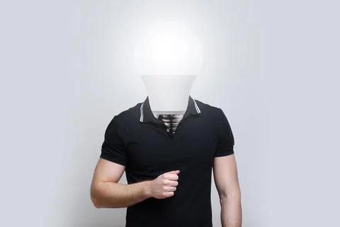 Young man with light bulb instead of head on grey background. Artwork collage Stock Photos