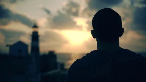 Young Man with Light Tower Sunset Flare Happiness 스톡 동영상 70545007