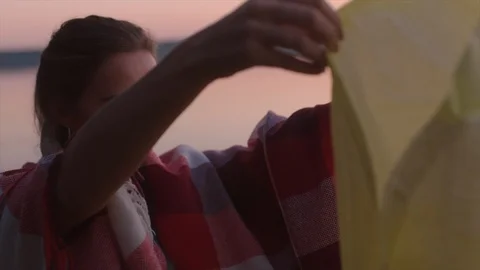 Young man is lighting sky lantern Stock Footage 98919873