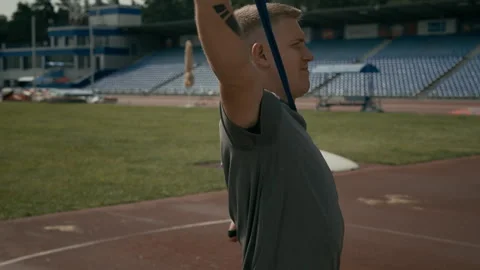 Young Man with Limb Difference Stretching Chest Muscles with Elastic Band Video stock 297957214