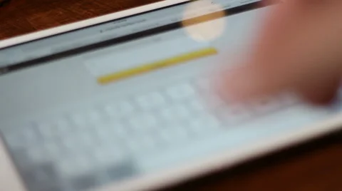 Young man logging in on Twitter via tablet computer Stock Footage 62053003