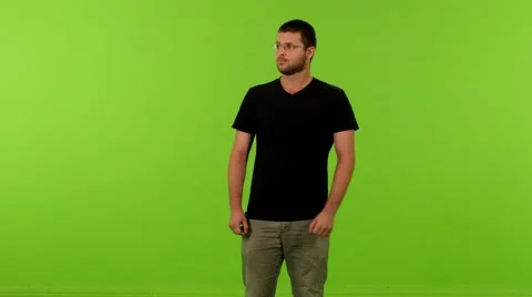 Young man look to camera greenscreen ms 4K 스톡 동영상 63049225