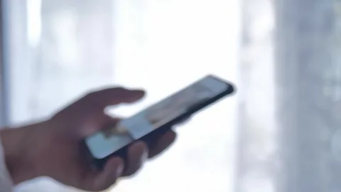 Young Man Look in Mobile Phone and Browse Social Network Close up Stock Footage 277409479