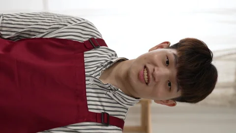 Young man looking up and smiling at the camera Stock Footage 229618409