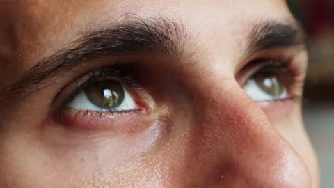 Young Man Looking Up Into Bright Light - Close Up Stock Footage 248766095