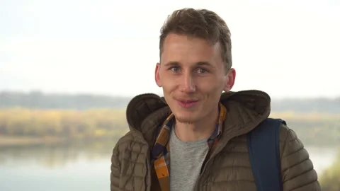 Young man looking to the camera and telling something interesting Stock Footage 100903688