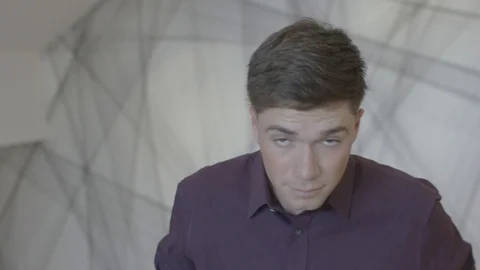 Young man looking at camera engaged in small company projects Stock-Footage 94236196