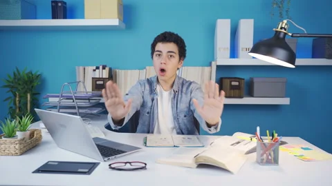 Young man looking at camera giving negative expression with hand. Stock Footage 233285975