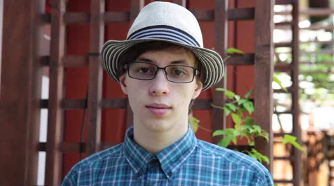 Young man looking at camera, hipster portrait, model, fashionable Stock Footage 51677415