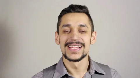 Young man looking at the camera. Kiss gesture Stock-Footage 75348382