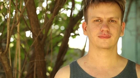 Young man is looking at the camera. on open air Stock Footage 78206183