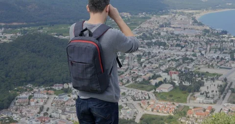 Young man looking at the city below Stock Footage 90176035