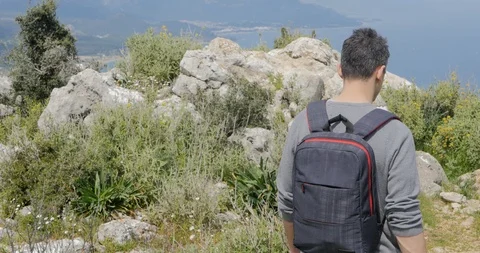 Young man looking at the city below Stock Footage 90836525