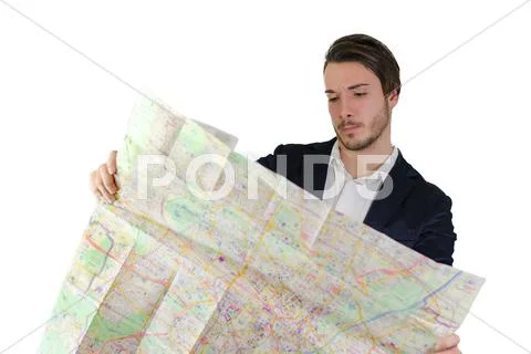 Young man looking at city map, confused or lost Stock Photos