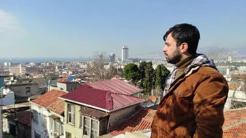 Young Man Looking at City From the Rooftop 2 Video stock 150188347
