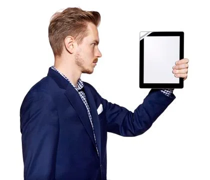 Young man is looking at digital tablet Stock Photos