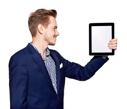 Young man is looking at digital tablet Stock Photos