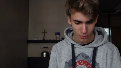 Young man looking down  - inside Video stock 112558227