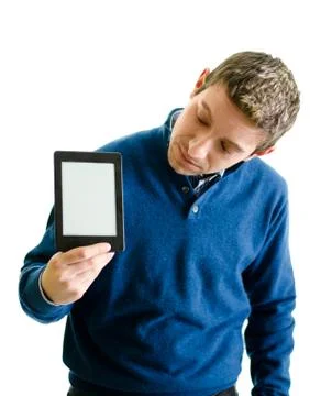 Young man looking at ebook reader Stock Photos