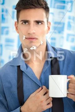 Young man looking his injury face in mirror Stock Photos