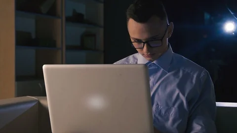 A young man is looking for information on the Internet Stock Footage 98305193