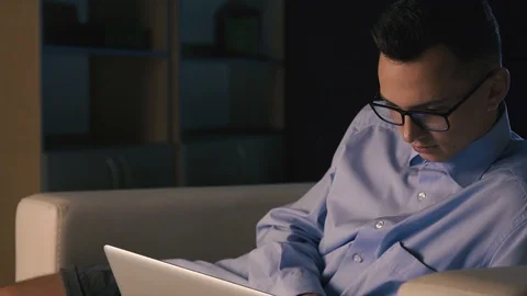 A young man is looking for information on the Internet Stock Footage 98305656