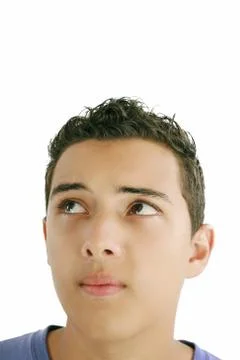Young man looking up into open space. isolated over white background. Stock Photos