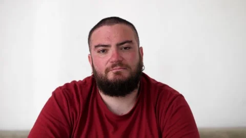 Young Man Looking Serious in Camera Stock Footage 295143274