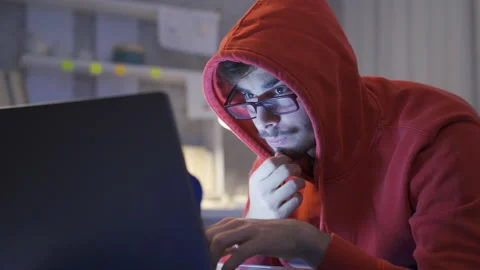 Young man looking at software in bed at night. Stock Footage 222560238